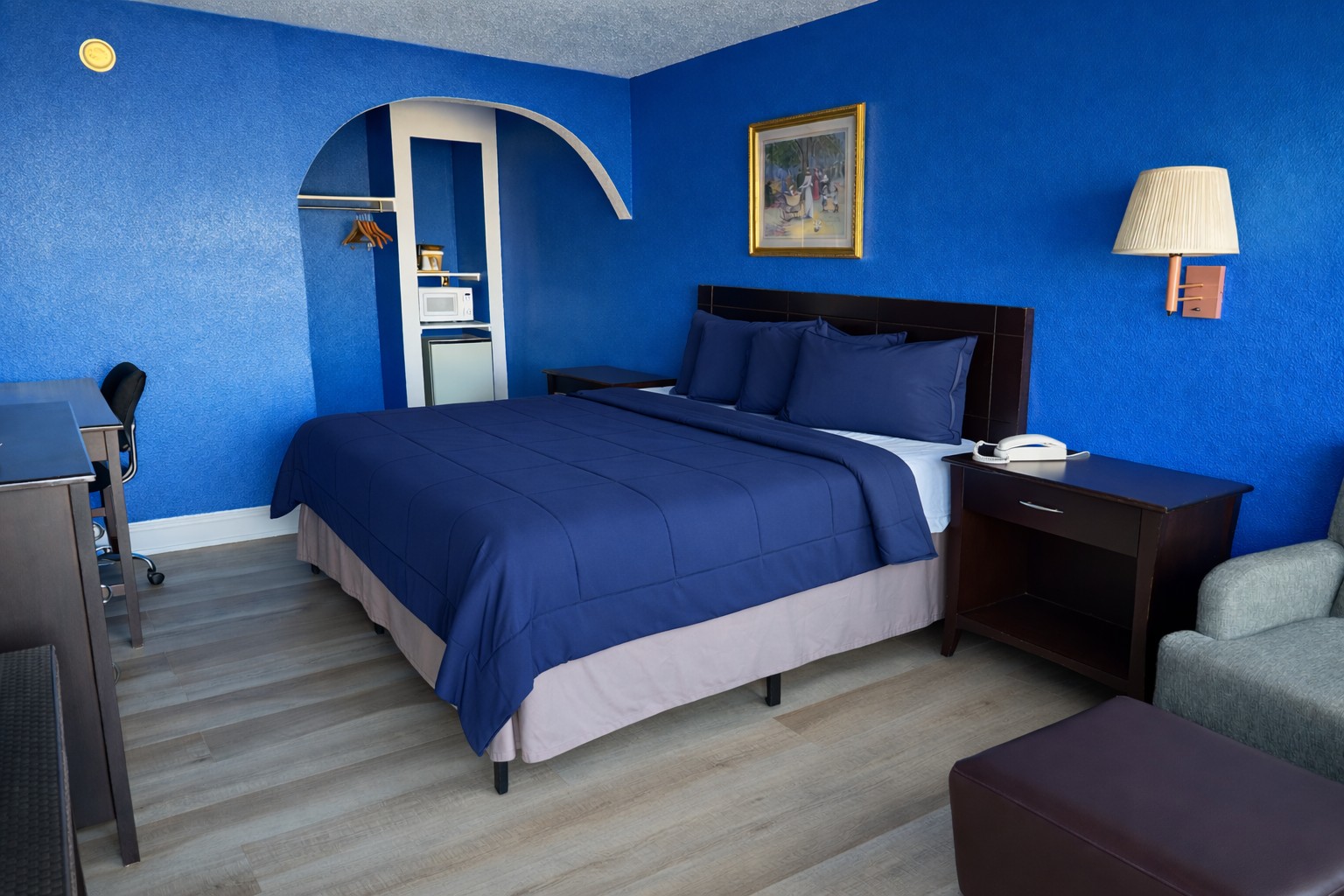 1 King Bed Room - King bed with vinyl flooring and flat-screen TV