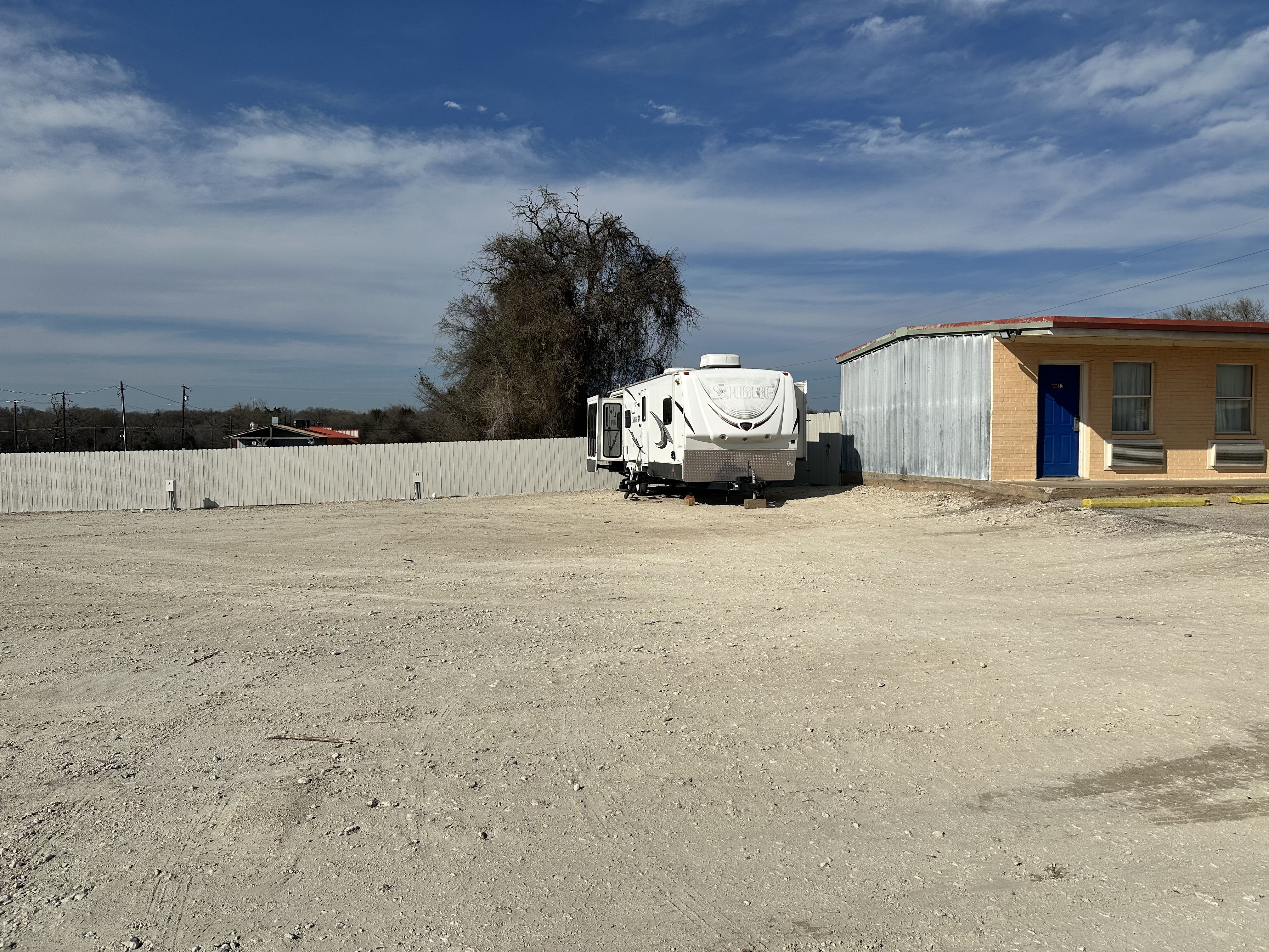 Full hookup RV site at Apollo Lodge RV Park in Fairfield, TX with electrical and water connections